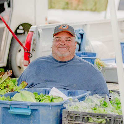Michael Koltonow with his fresh local produce at the Livingston Farmers Market