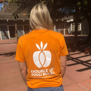 girl wearing double SNAP dollars tshirt during intents conference in san diego by farmers market pros